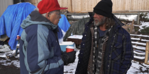 Fr. Leo Coughlin talks to people living on the street about the need for Peterborough Action For Tiny Homes